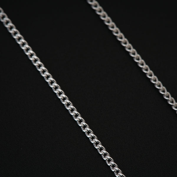a close up of a chain on a black background