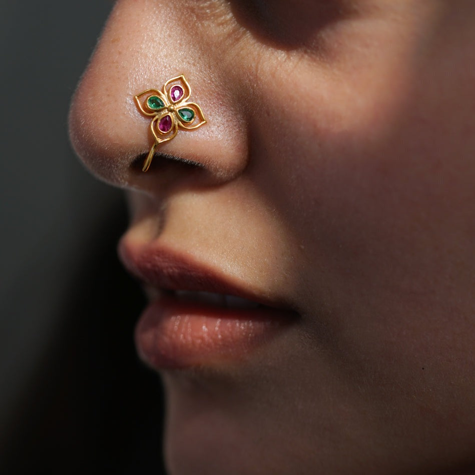 a close up of a person with a nose piercing