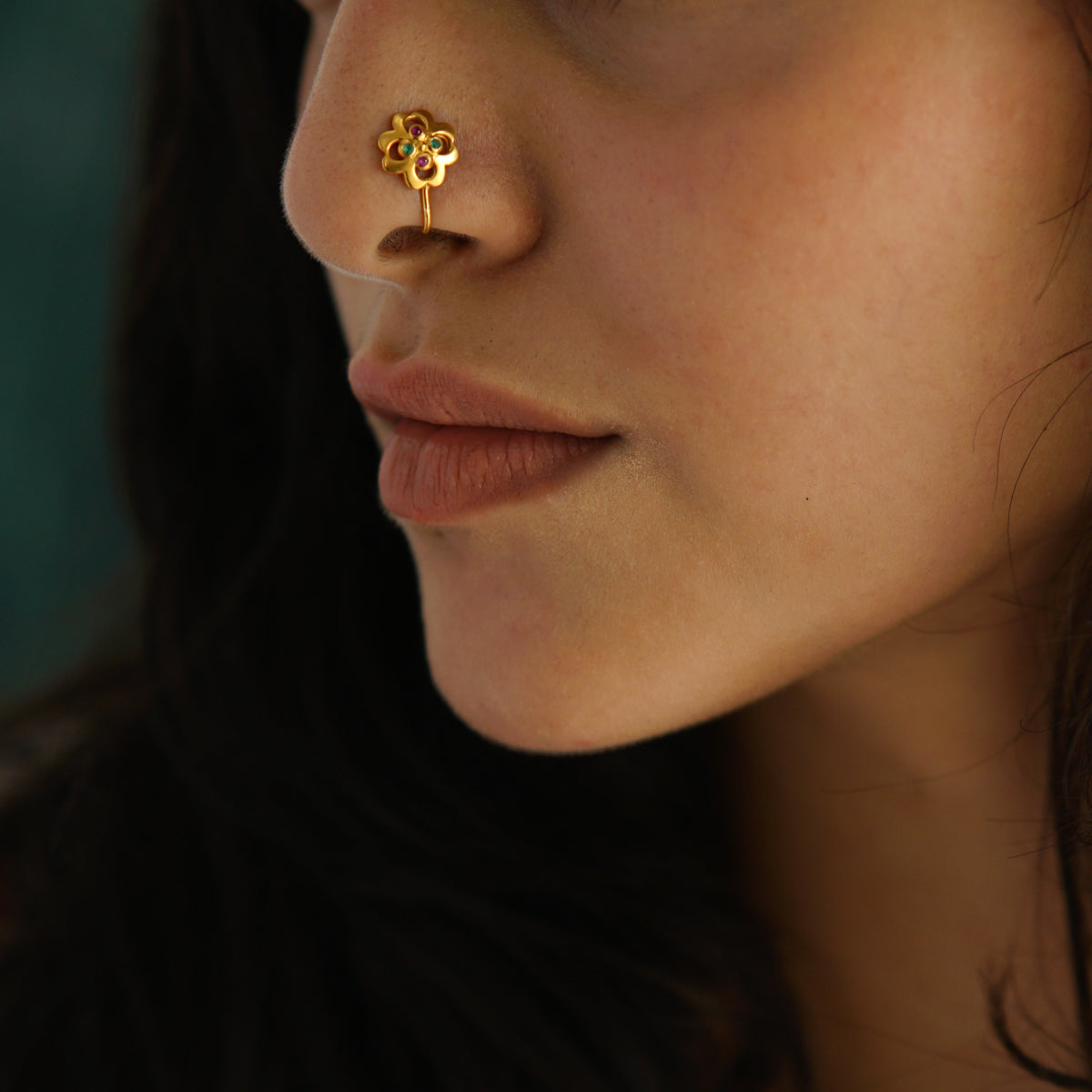 a close up of a person with a nose piercing