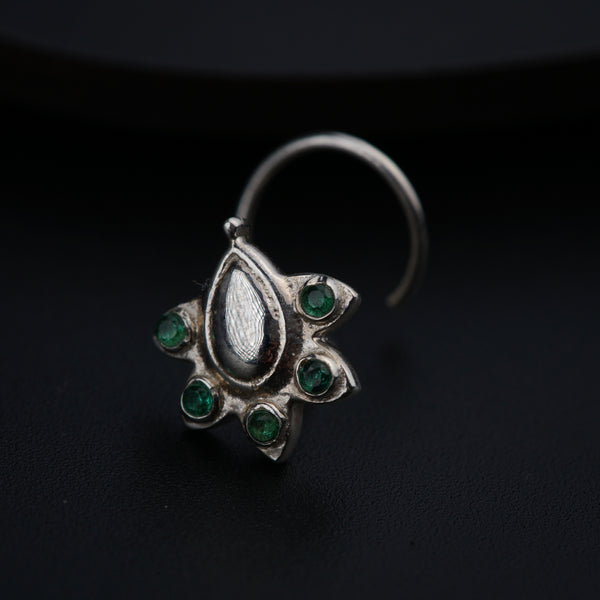 a close up of a ring on a black surface