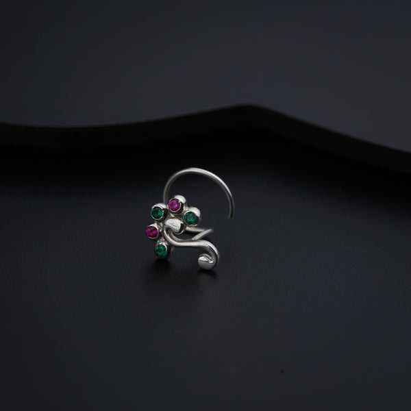 a close up of a ring on a black surface