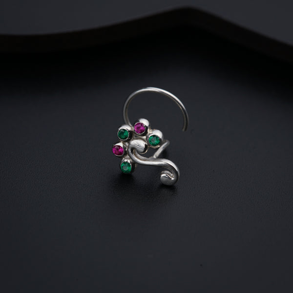 a close up of a ring on a black surface