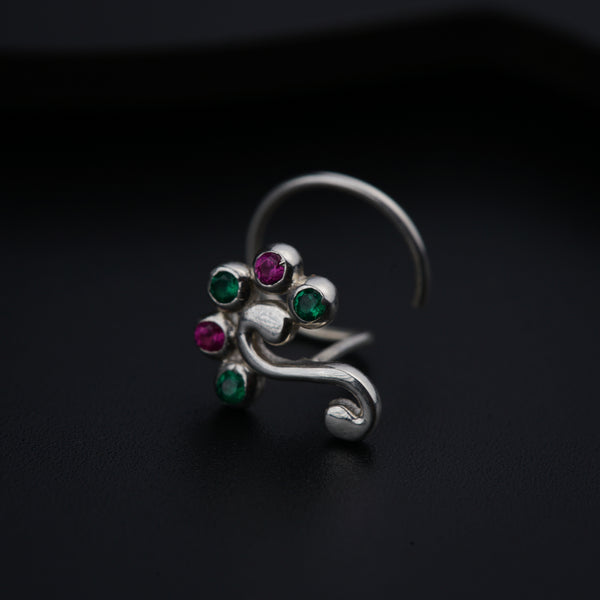 a close up of a ring on a black surface