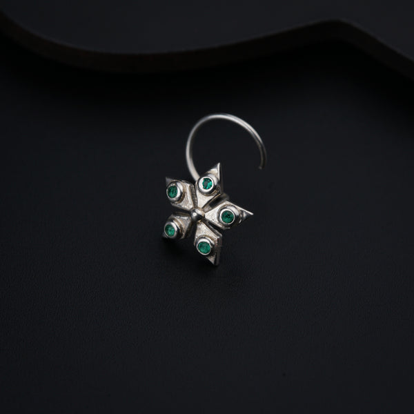 a close up of a ring on a black surface