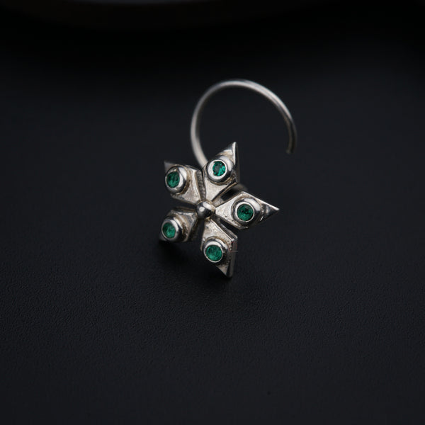 a close up of a ring on a black surface