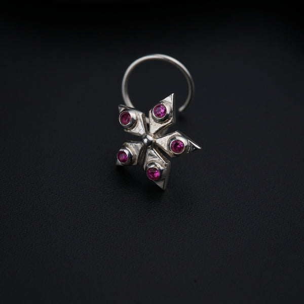 a close up of a ring on a black surface