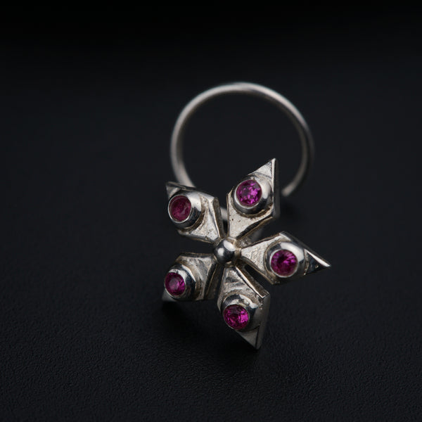 a close up of a ring on a black surface