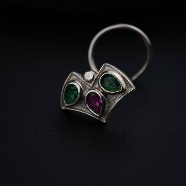 a close up of a ring on a black surface