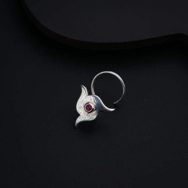 a close up of a ring on a black surface