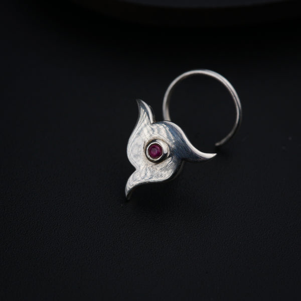 a close up of a ring on a black surface