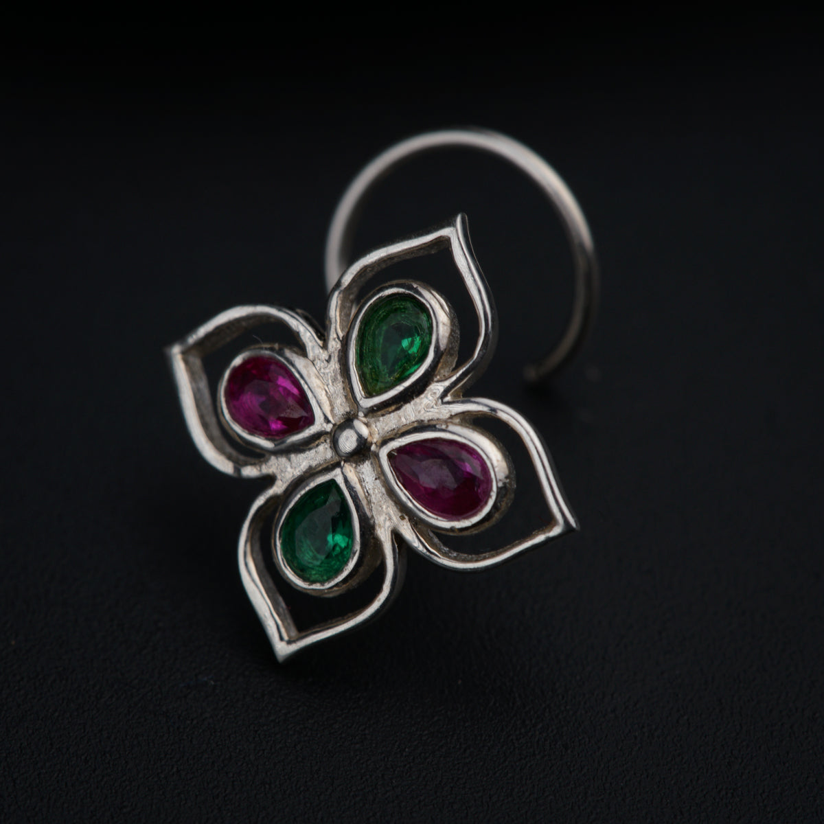 a close up of a ring on a black surface