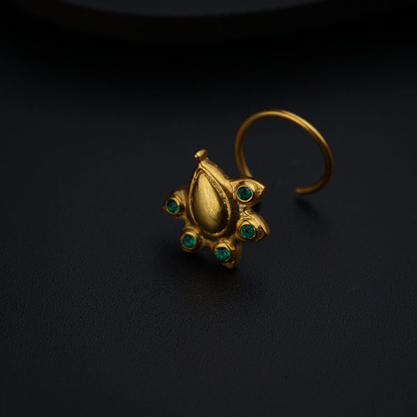 a close up of a ring on a black surface