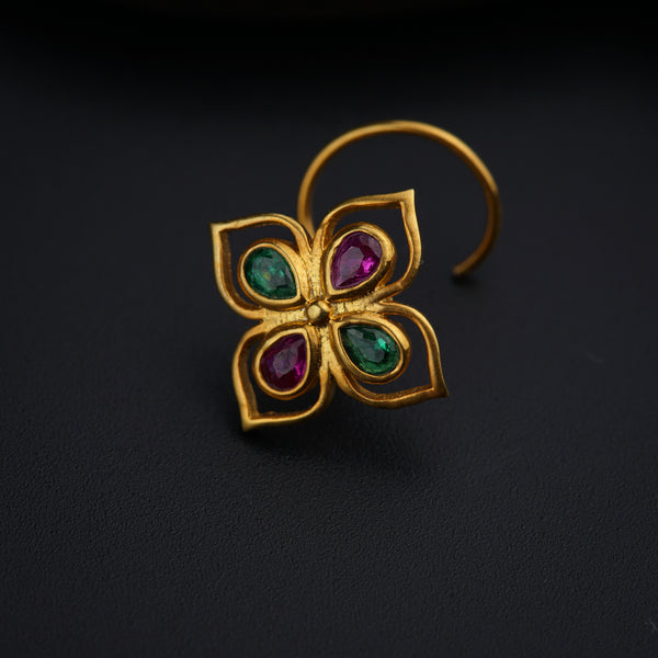 a close up of a ring with a flower design