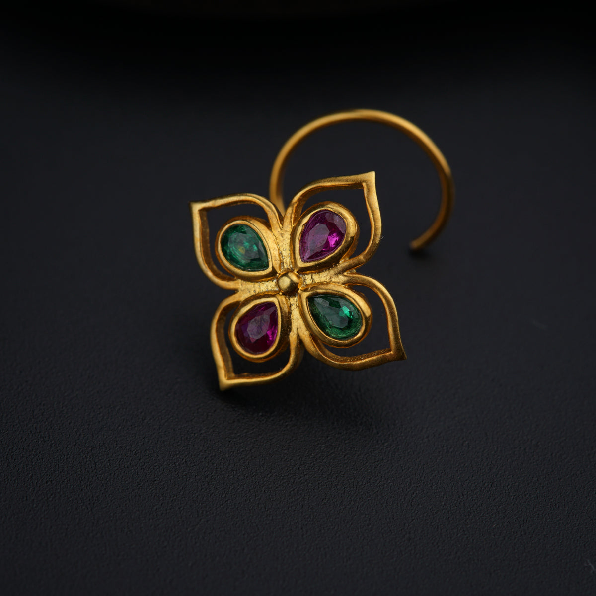 a close up of a ring with a flower design