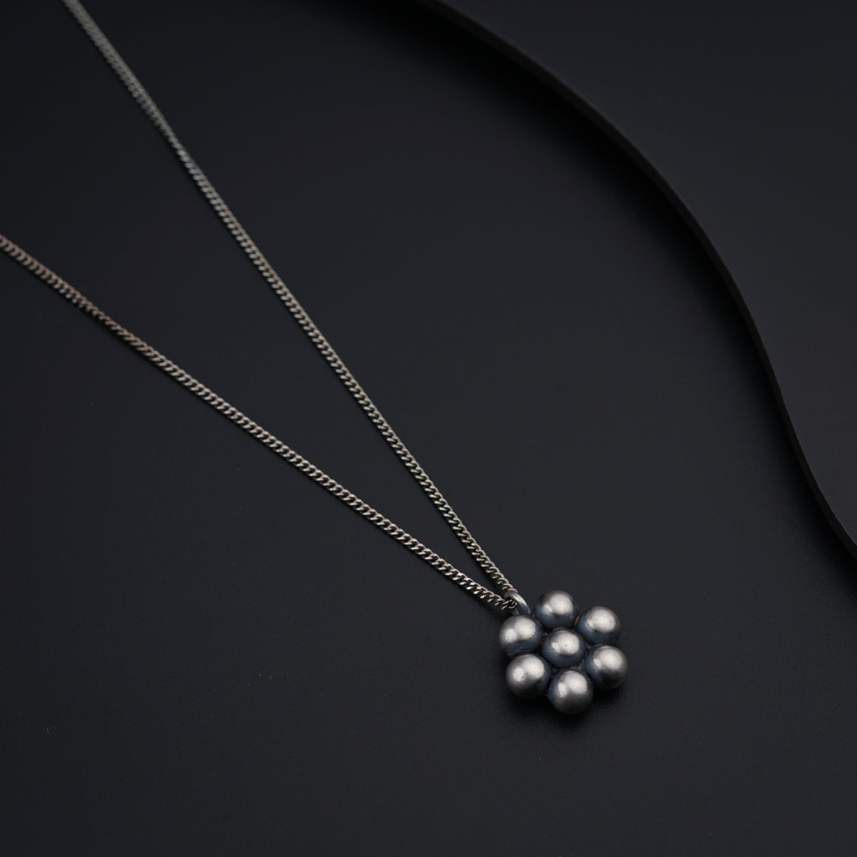 a couple of necklaces sitting on top of a table