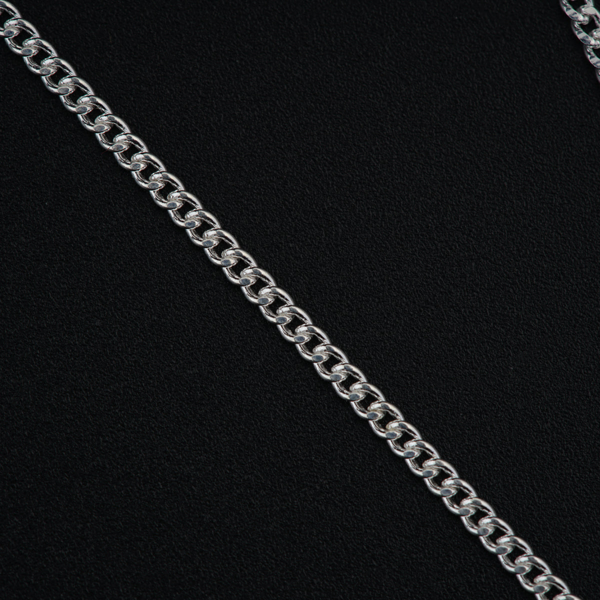 a close up of a chain on a black background