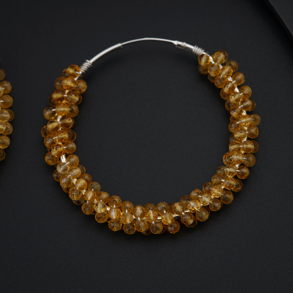 a close up of a pair of earrings on a table