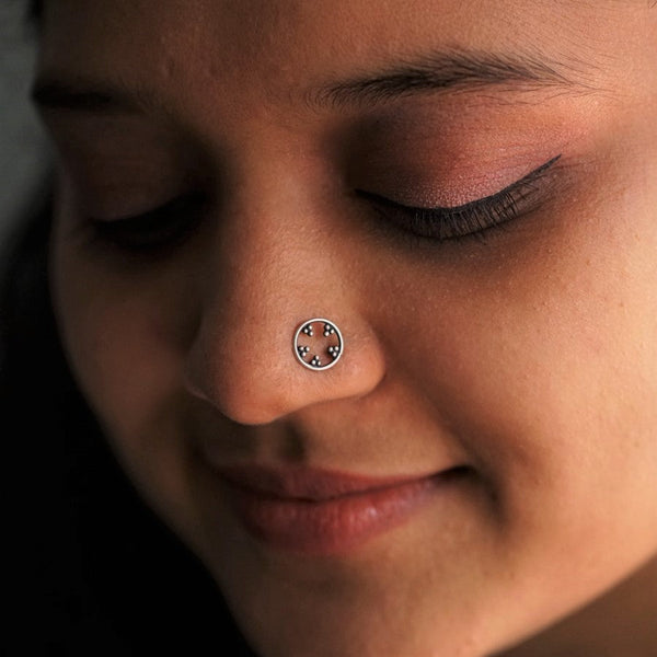 a close up of a person with a nose piercing