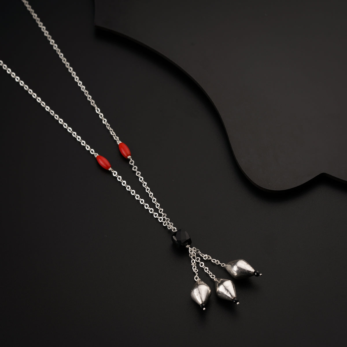Silver necklace with dholaki beads and corals