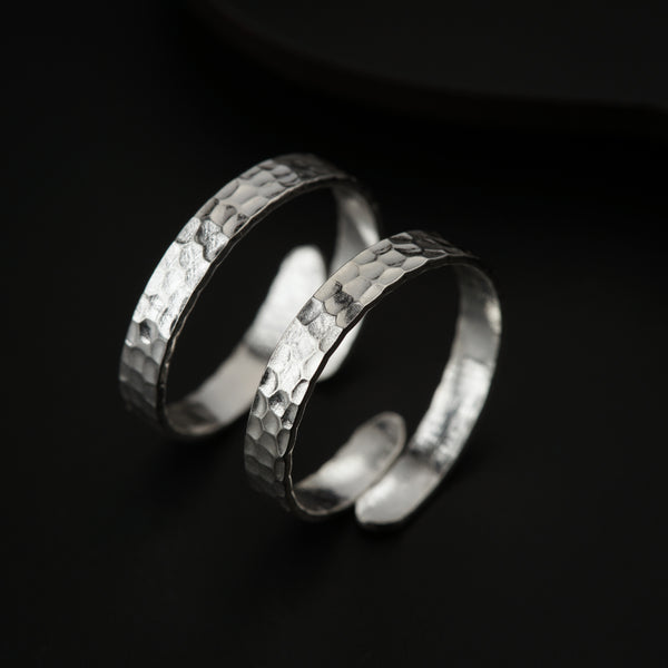 Close-up of hammered sterling silver toe ring highlighting artisanal texture and polished edges