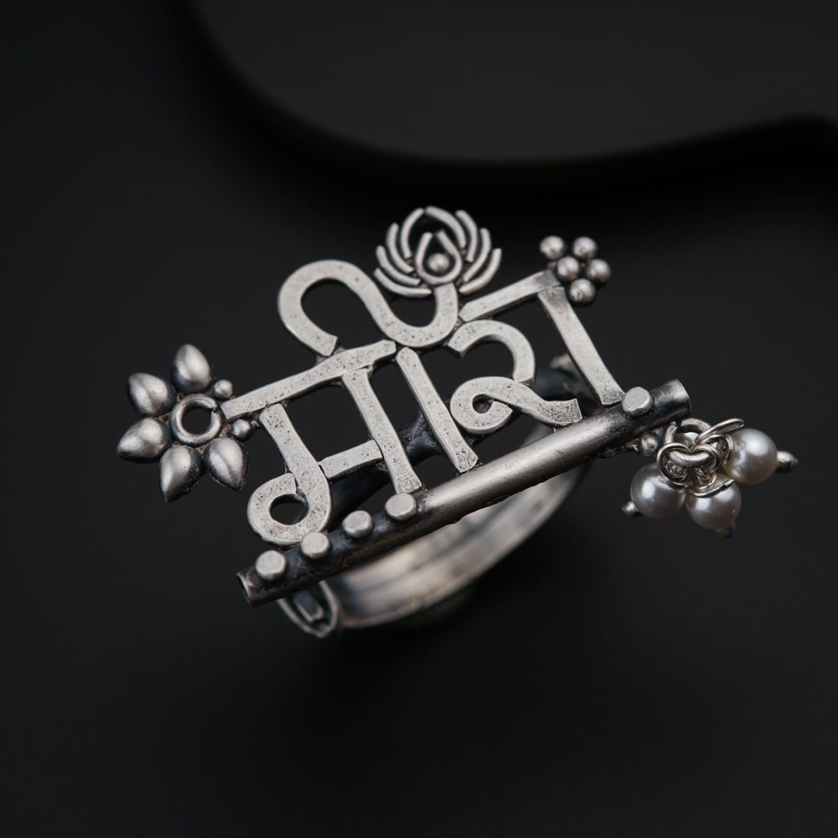 a silver ring with the word india on it