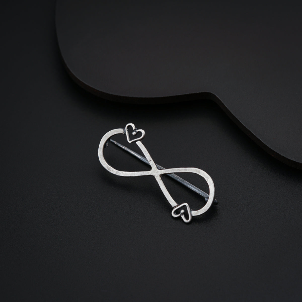a pair of scissors sitting on top of a black table