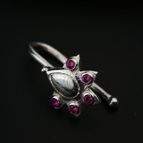 a close up of a ring on a black surface