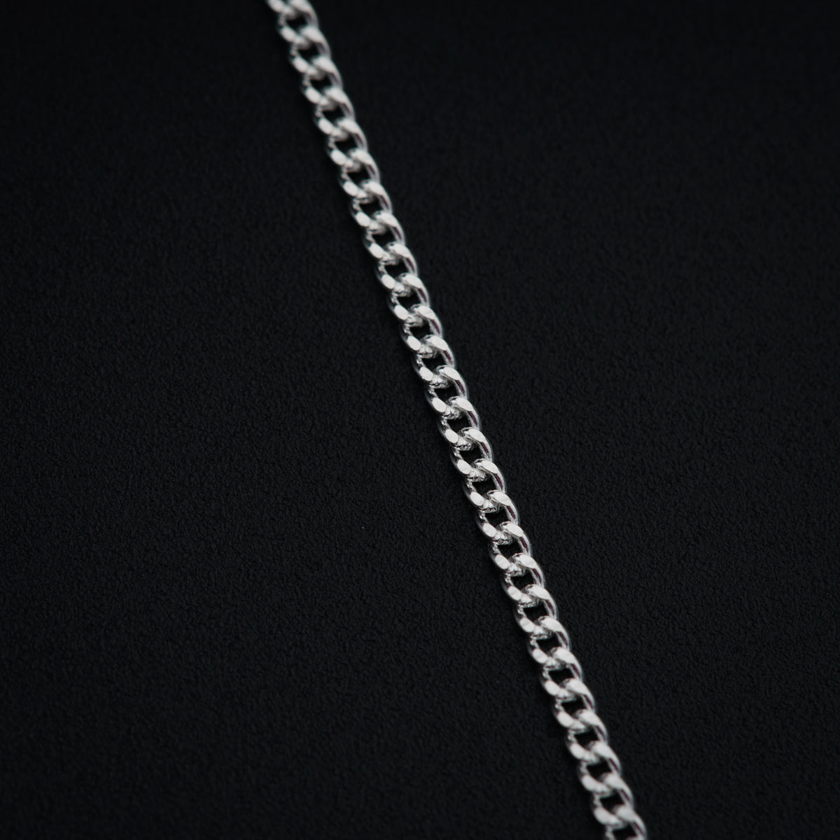 a close up of a chain on a black background
