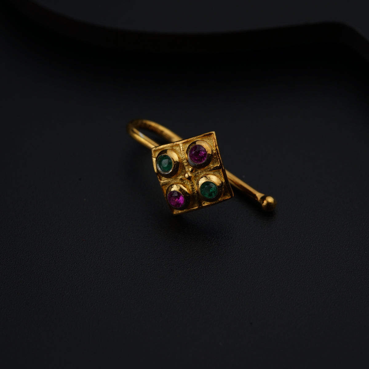 a close up of a ring on a black surface