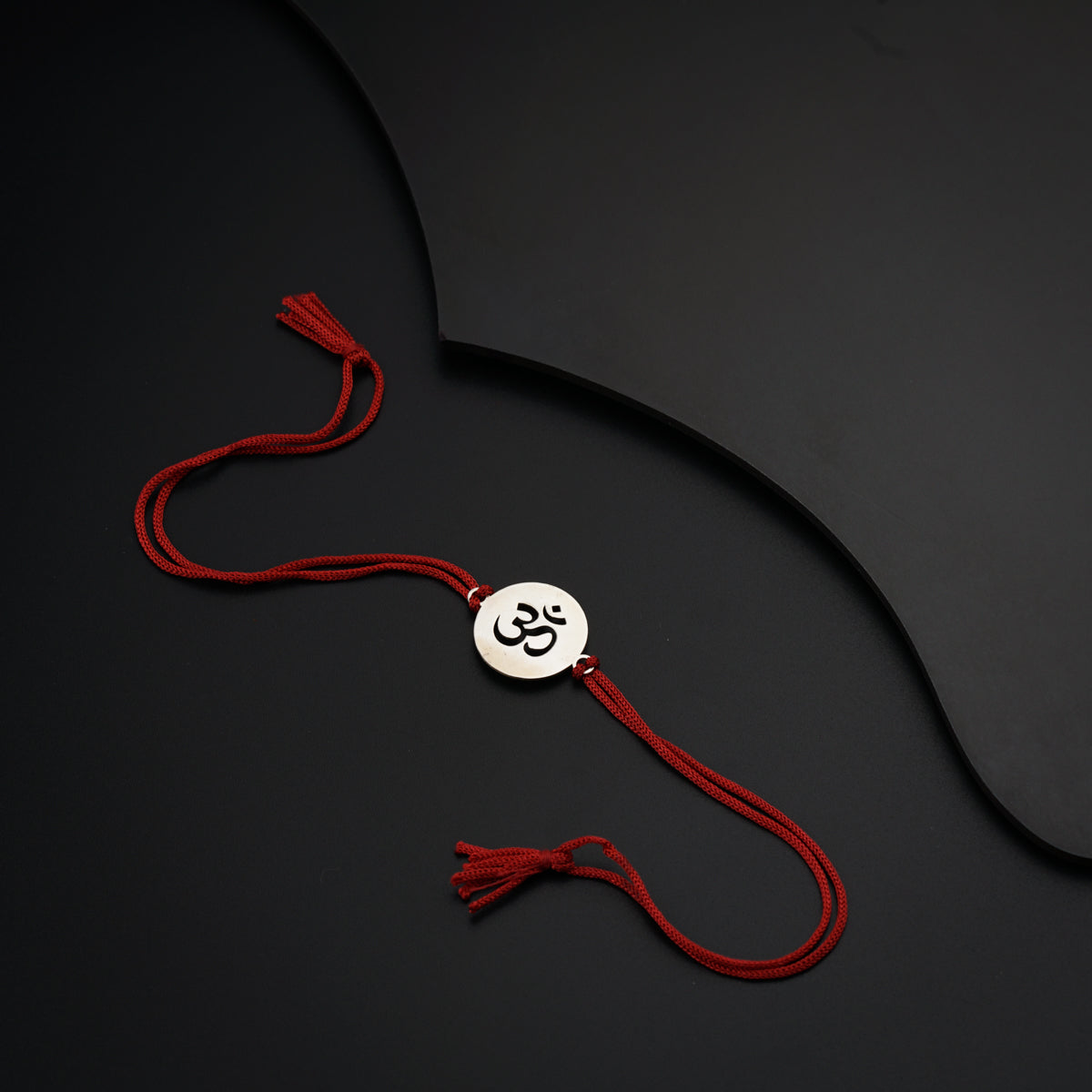 a red string with a smiley face on it