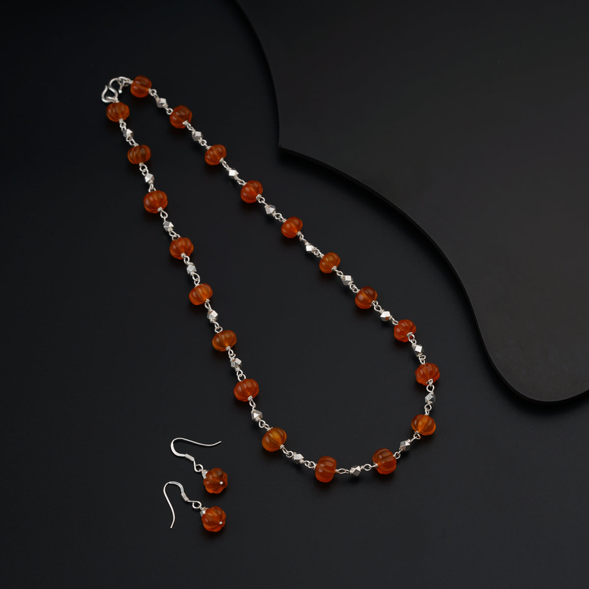 Silver set with carved Carnelian stones