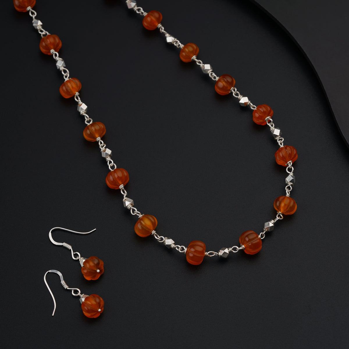 Silver set with carved Carnelian stones