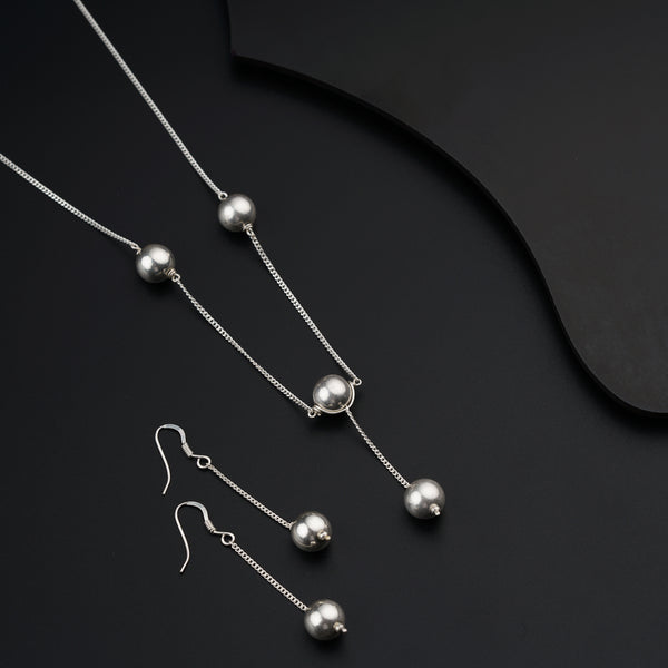 a set of three necklaces and a pair of earrings