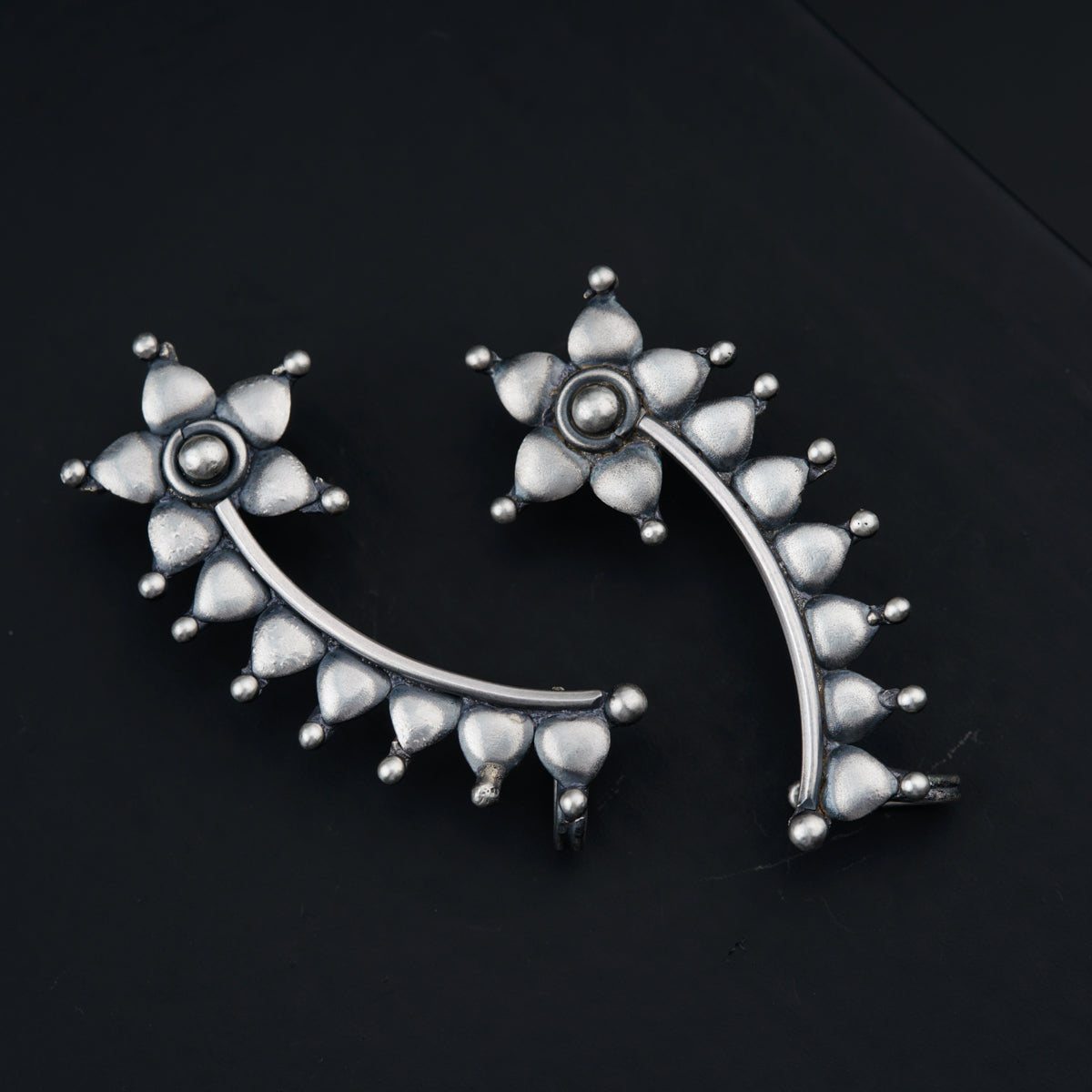 a close up of a pair of earrings