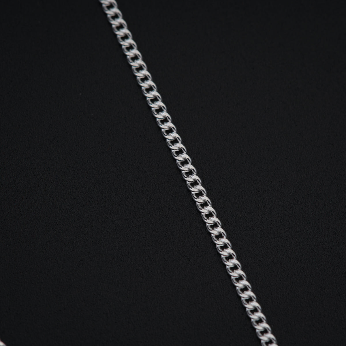 a close up of a chain on a black background