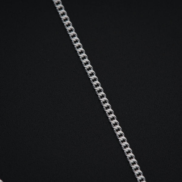 a close up of a chain on a black background