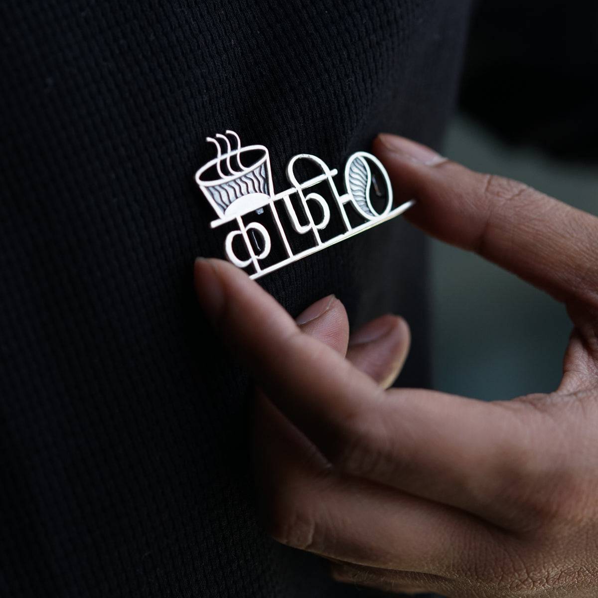 a person is holding a sticker in their hand