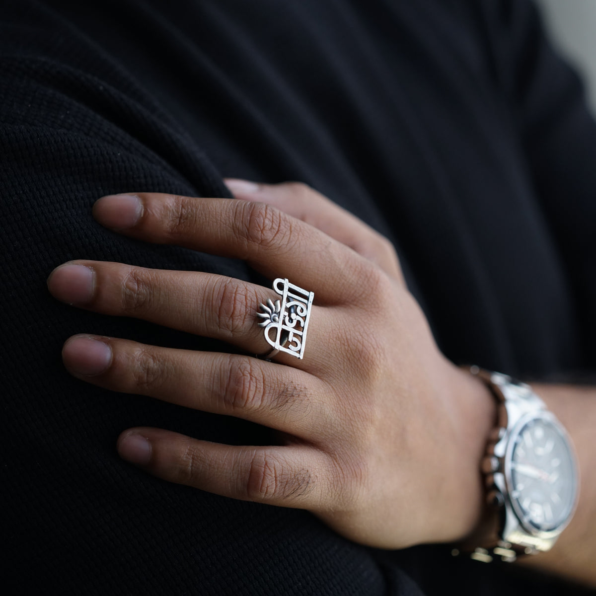 a close up of a person wearing a ring