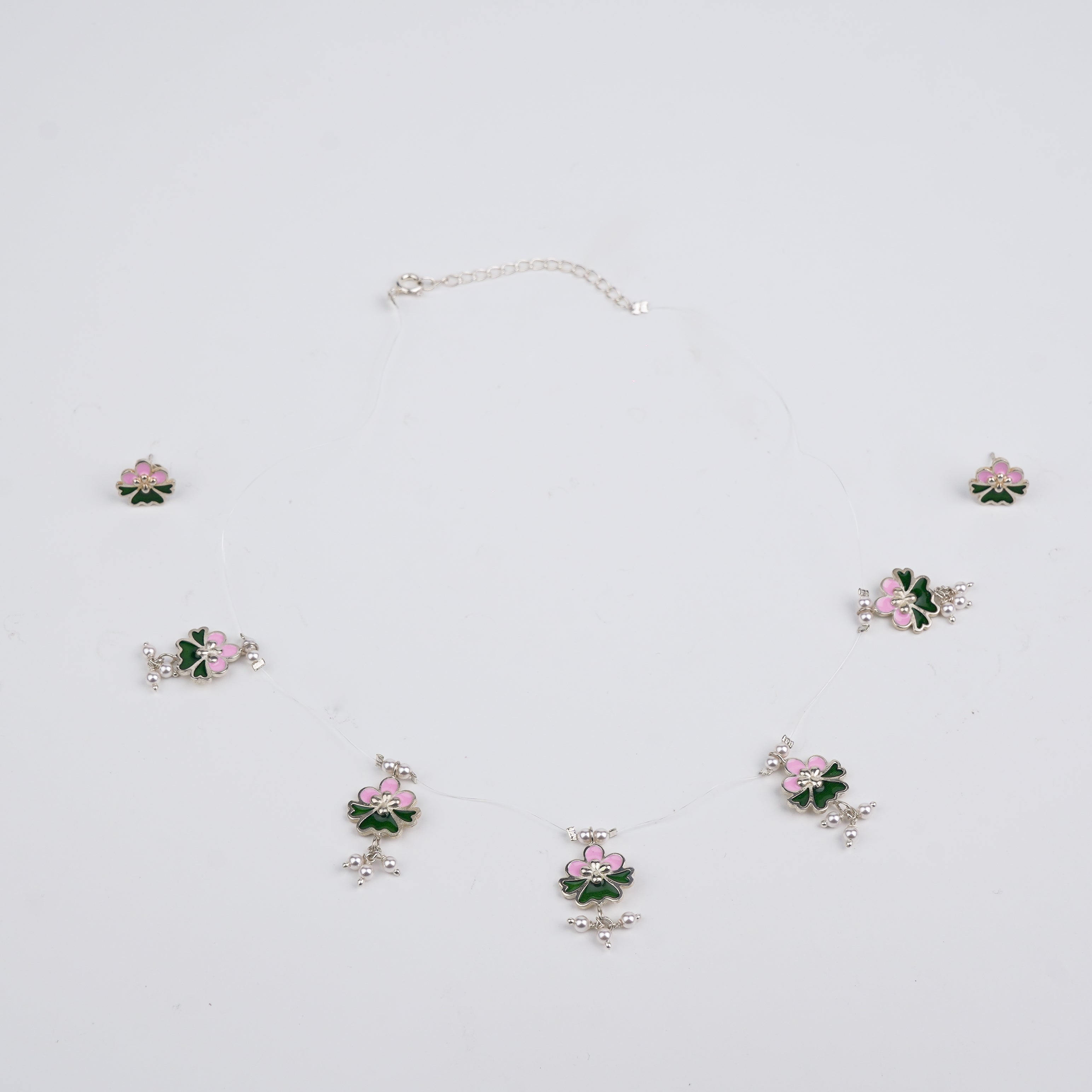 Meena charm set with invisible thread