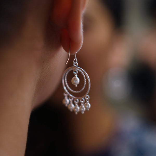 Small silver pearl chandbali earrings detailing