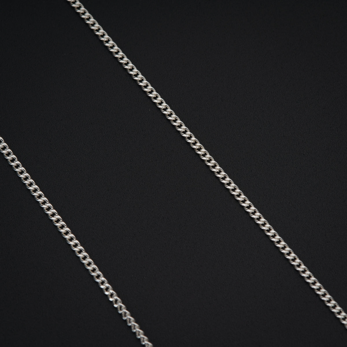 a close up of a chain on a black background