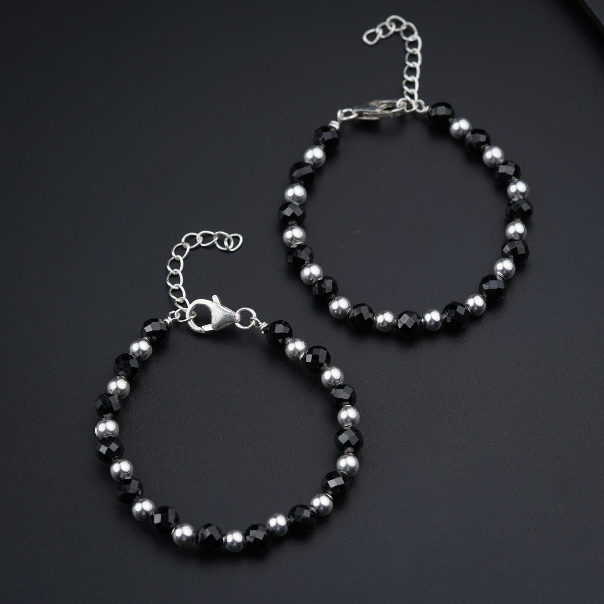 a couple of bracelets sitting on top of a table