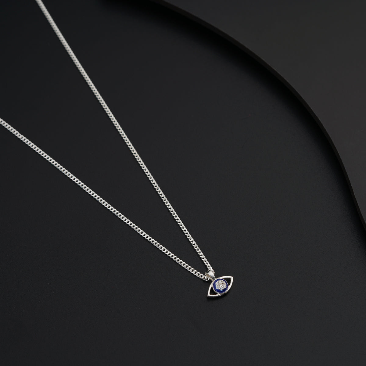 a couple of necklaces sitting on top of a table