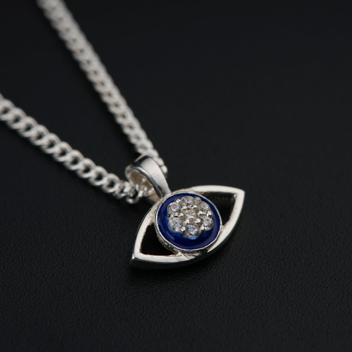 a silver necklace with a blue and white pendant
