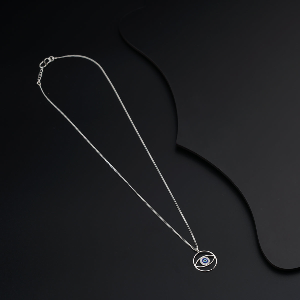 a necklace with an evil eye on it
