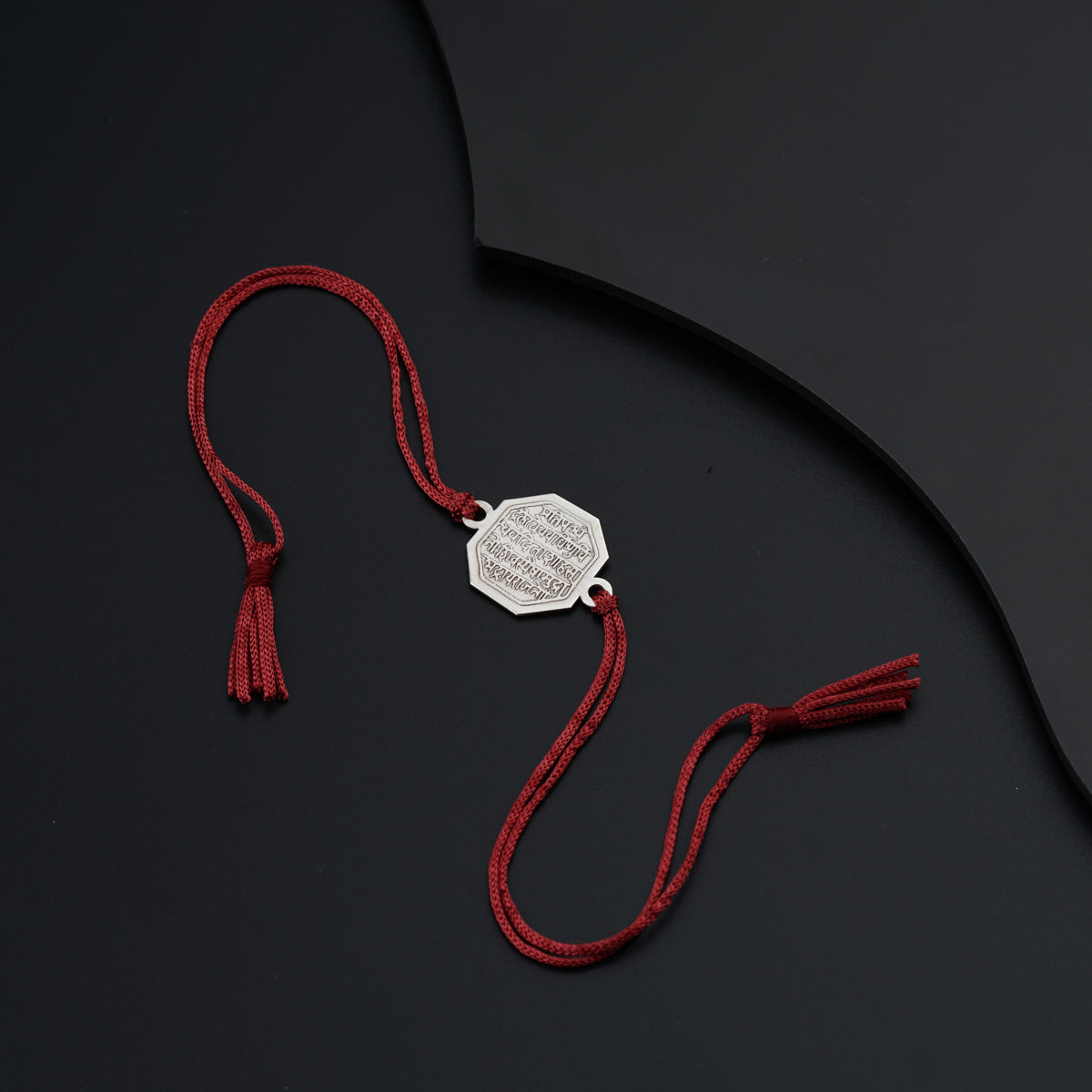 a red string with a tag attached to it