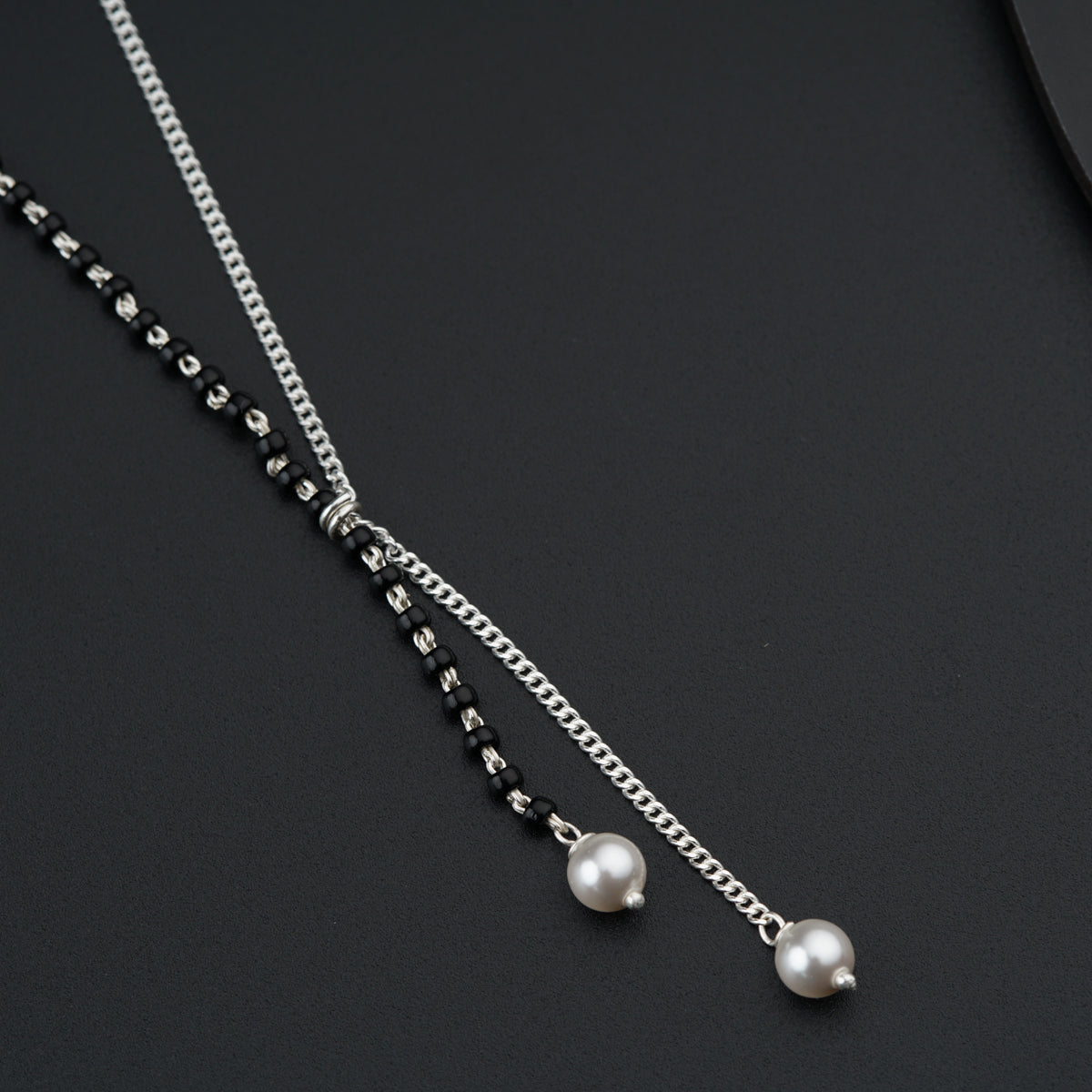 a couple of necklaces sitting on top of a table