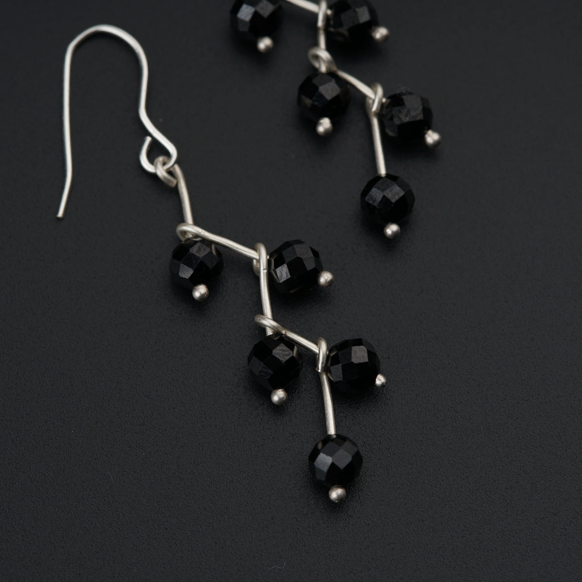 a pair of black glass beaded earrings
