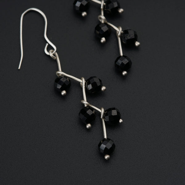 a pair of black glass beaded earrings