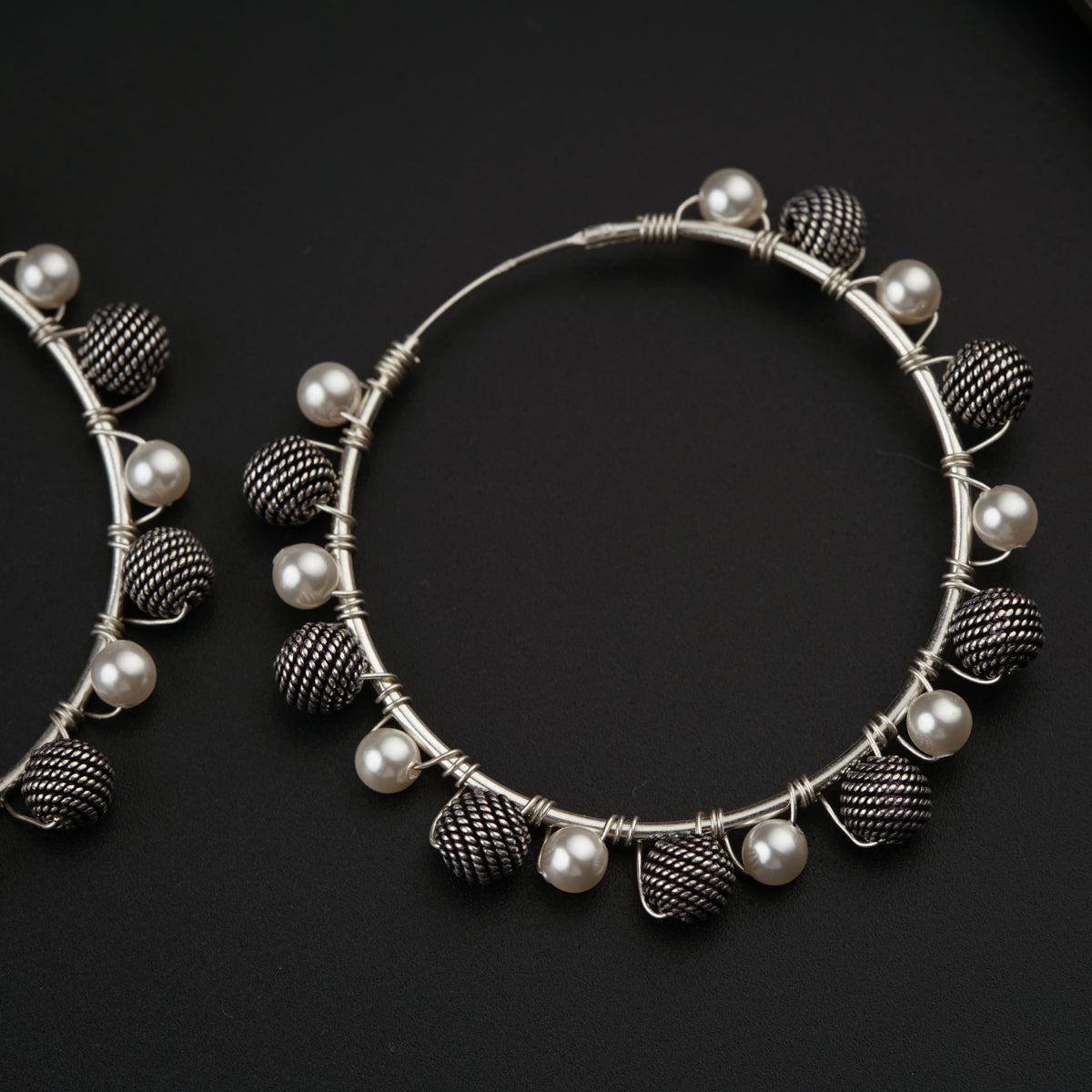 a close up of a pair of hoop earrings